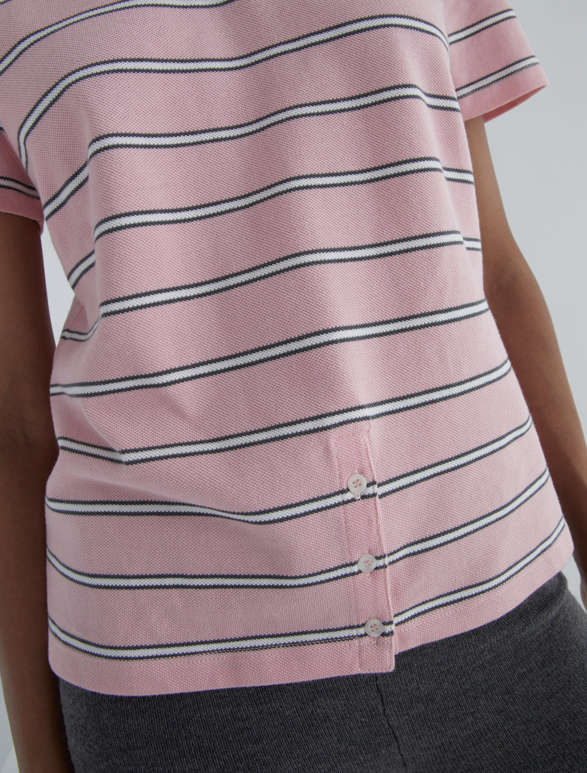 Julieta striped pique polo buttoned placket lower front pink