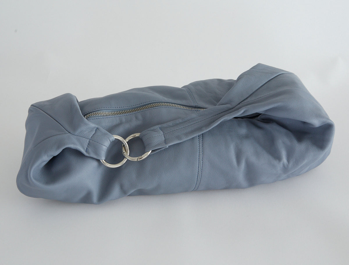 Dry elongated wrap around hobo style shoulder bag lightgreyishblue